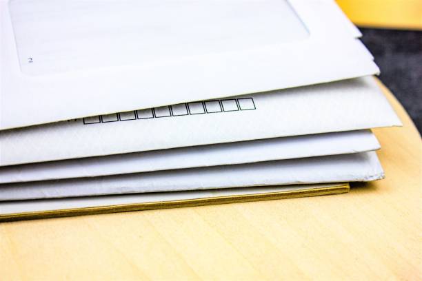 istock A stack of letters in envelopes. Old paper envelopes with letters. 1421458092