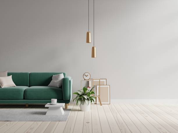 istock Green sofa with table on gray wall and wooden flooring. 1421461386