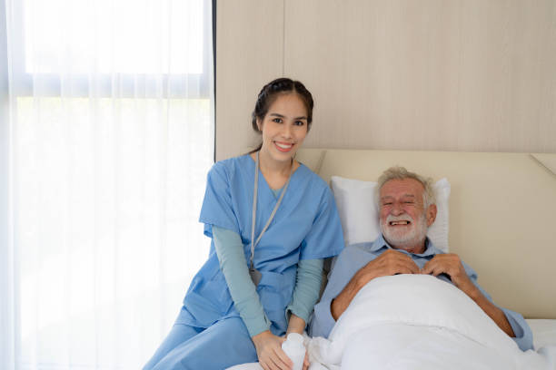 istock Home nurse is in visit to an elderly man with physical disabilities. 1421467997
