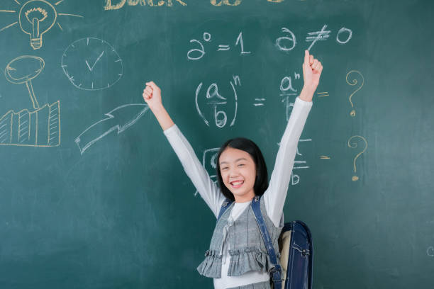 istock Smiling asian girl student intelligent smart idea creative front blackboard in classroom school, Education learning study back to school concept. 1421468917