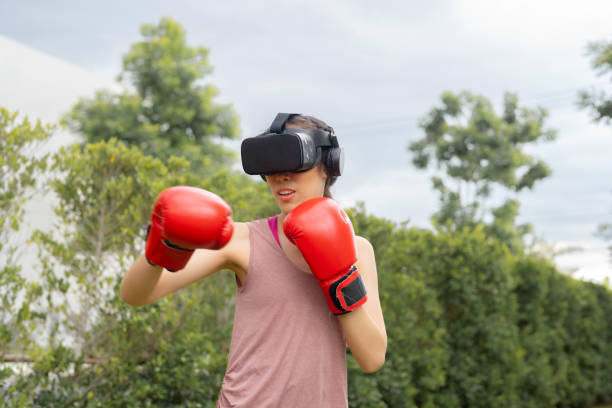 istock Young woman is exercise with virtual reality glasses. 1421471048