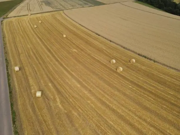 Aerial view of haybales on a agriculture field on a sunny day in summer