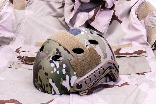 American Military Helmet On Desert Camouflage Shirt