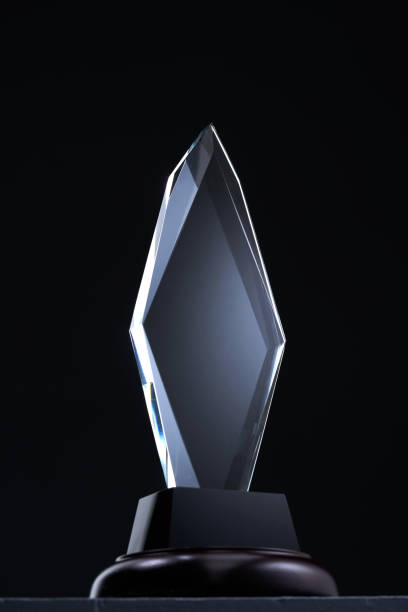 istock diamond shape crystal trophy against black background 1421486920