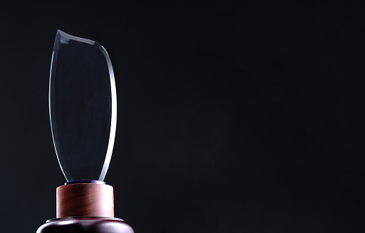 crystal trophy against black background
