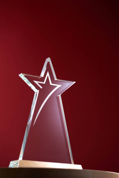 istock star shape crystal trophy against red background 1421487065