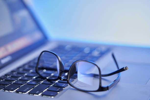 eyeglasses on laptop keyboard