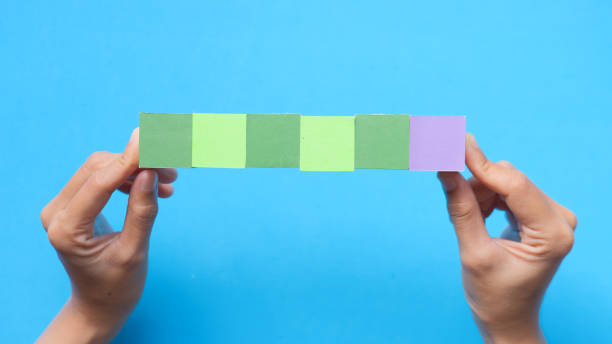 istock Hands choosing colorful wooden blocks 1421488209