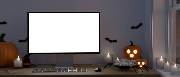 istock Modern dark office desk workspace with a Halloween theme, white PC desktop computer mockup 1421488422