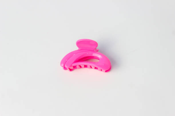 istock A Pink-colored Jaws Hair Clip Isolated on a White Background 1421489862