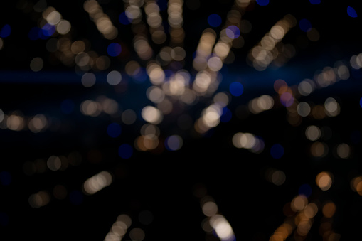 On a black background bokeh from explosions of colorful fireworks.