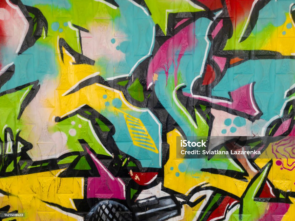 Part of a bright multi-colored wall graffiti. Youth art culture. Graffiti Stock Photo