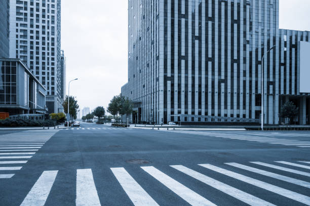 istock empty road with zebra crossing and skyscrapers in modern city 1421510536