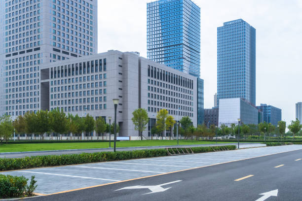 istock empty urban road with modern building in the city 1421510593