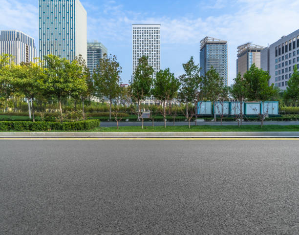 istock empty urban road with modern building in the city 1421511125