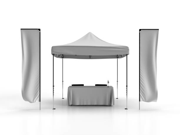 Outdoor Exhibition Display Stand 3D Rendered Illustration Front view of a Gazebo Tent with Telescopic advertising banner flags and a table cloth with two directors chairs and a table flag on top of the table. Isolated on a white background for mockup and illustrations as a graphic resource for graphic designers. tent banner stock pictures, royalty-free photos & images