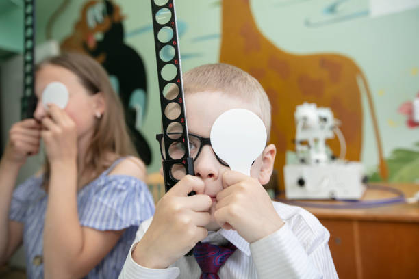 A doctor with special eye equipment corrects vision problems in children.