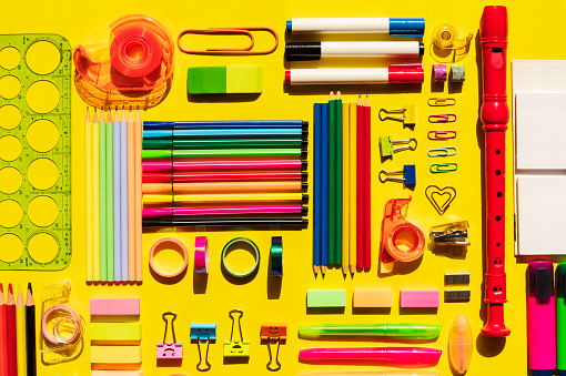 Back to school flat lay on yellow background