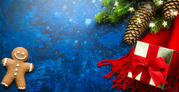 istock Christmas Tree with Decorations Light and Holiday Gift on Blue Background. New Year. Noel. Top view. Winter xmas Flat lay. 1421515900