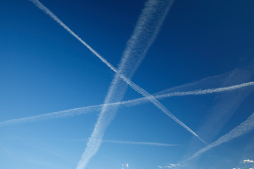 Crossing Contrails against blue sky