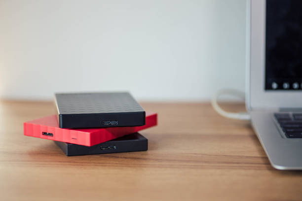 Storage Hard Drives Stacked on a Desk