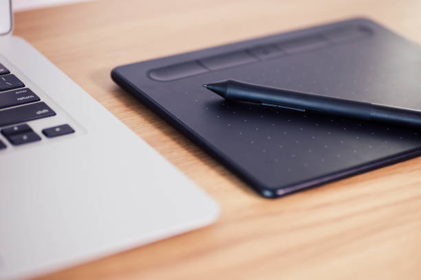 istock Graphic Tablet used for illustration and business on a desk 1421519033