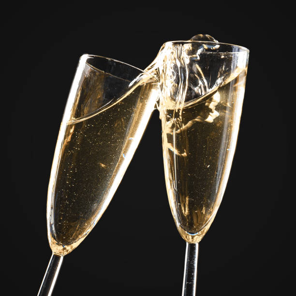 istock Glasses of champagne with splash 1421519501