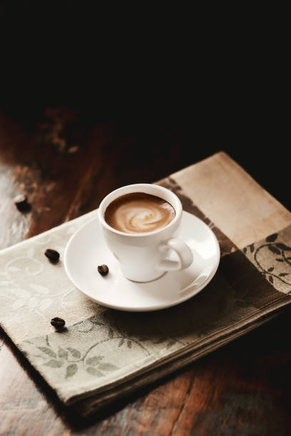 istock Cup of coffee on dark wooden background. Copy space. 1421530147