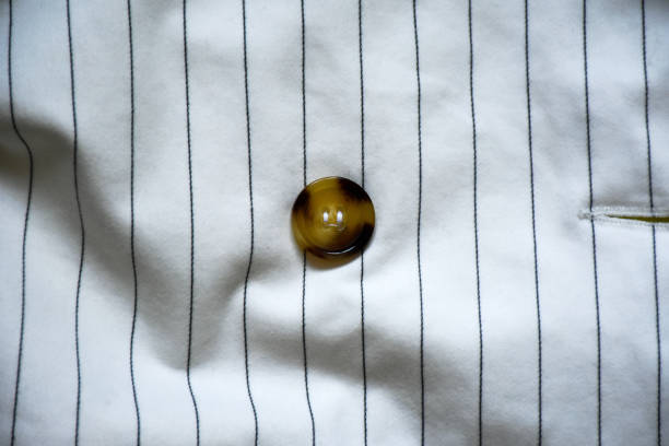 Button on the striped white fabric clothing