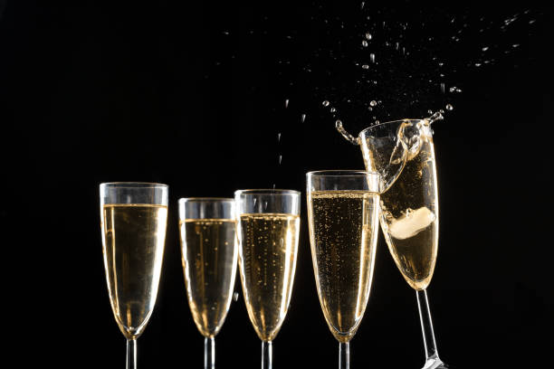 istock Glasses of champagne with splash 1421535858
