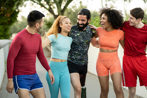 group of multiracial sporty friends happy as they start their training outdoors.