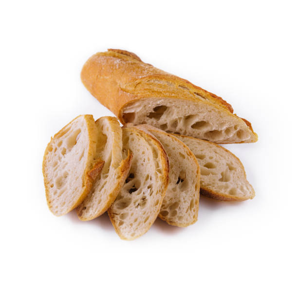 istock Sliced traditional french baguette on white 1421541419