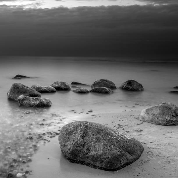 istock Stones on the beach. Black and white photography. 1421543084