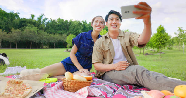 istock couple take selfie with mobile 1421545288