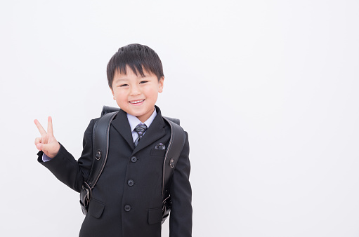 Japanese boy carrying a school bag