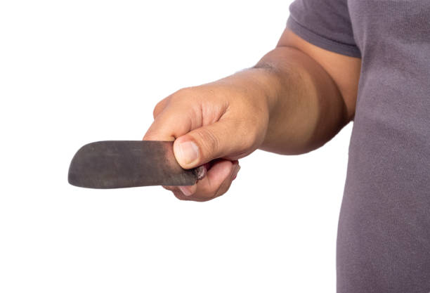 a man holding a kitchen knife, concept photo illustration defending himself, threatening or killing and robbing