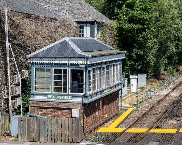 Signal box along railroad tracks in Hampshire, UK. Signal box at Petersfield station along side the railway tracks petersfield stock pictures, royalty-free photos & images