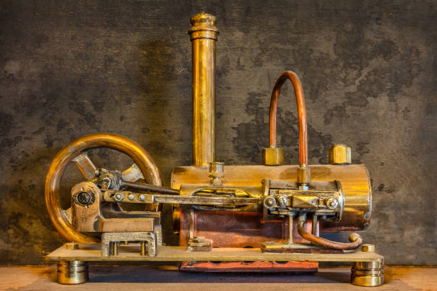 istock Steam engine in front of a weathered black wall 1421550763