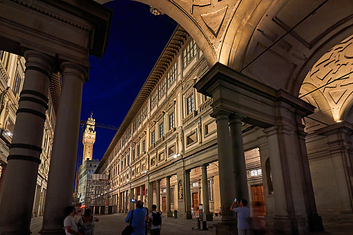 Florence, Italy - September 06, 2022: people at Piazzale degli Uffizi at night in Florence.