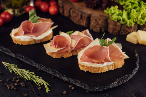 istock bruschetta set with parma ham and parmesan cheese 1421554571