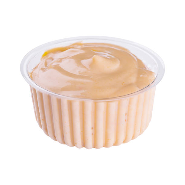 istock Small pot of garlic mayonnaise isolated 1421554600