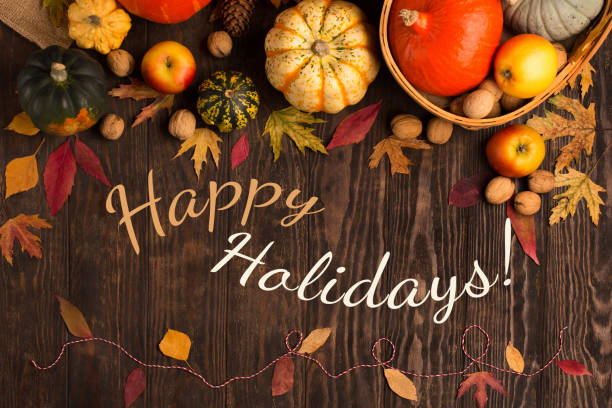 istock Autumn Leaves, Pumpkins, Apples, Nuts on Rustic Wooden Background. 1421556754