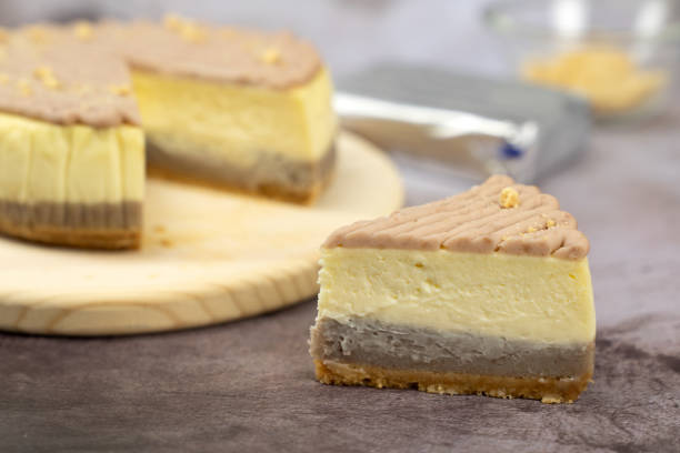 istock Taro cheese cake on wooden board 1421567067