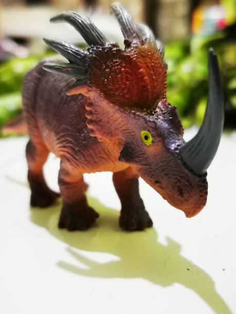 istock Dinosaurs resembling brownish one-horned rhinoceros 1421567695