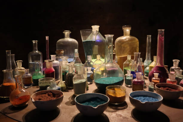 Glass flasks filled with alchemical substance stock photo