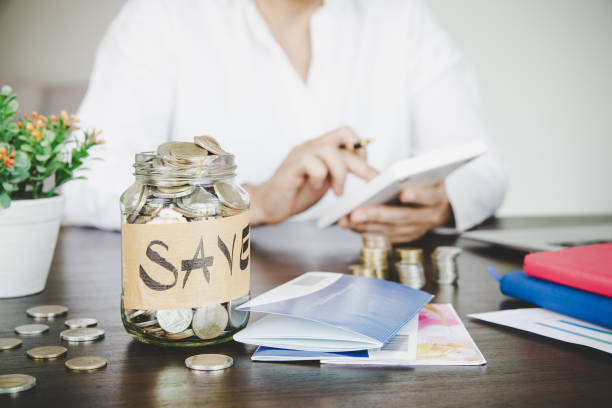istock a woman makes calculations, checks her finances, makes notes in a notebook 1421570887