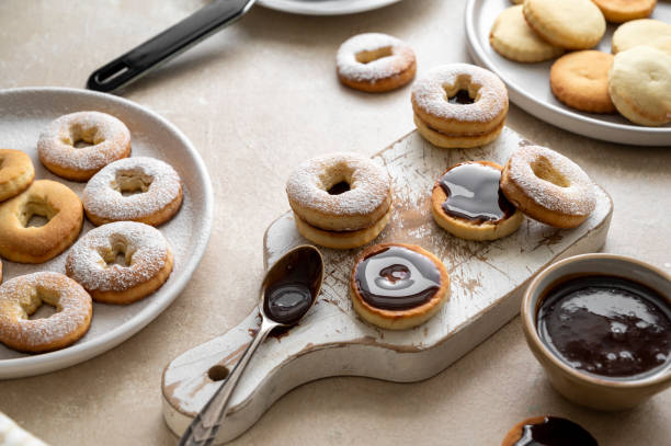 istock Cooking cookies process. Homemade linzer cookies with chocolate. 1421571027