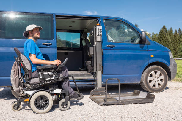 istock Man getting out the van by using a wheelchair car lift 1421571583