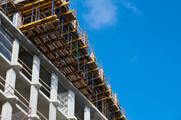 istock Construction of new building with reinforced concrete floors, blue sky copy space 1421571869