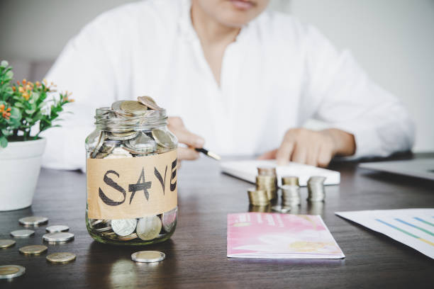 istock a woman makes calculations, checks her finances, makes notes in a notebook 1421572379